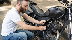 Motorcycle hit by an uninsured car, representing Uninsured/Under-insured Motorist Coverage.